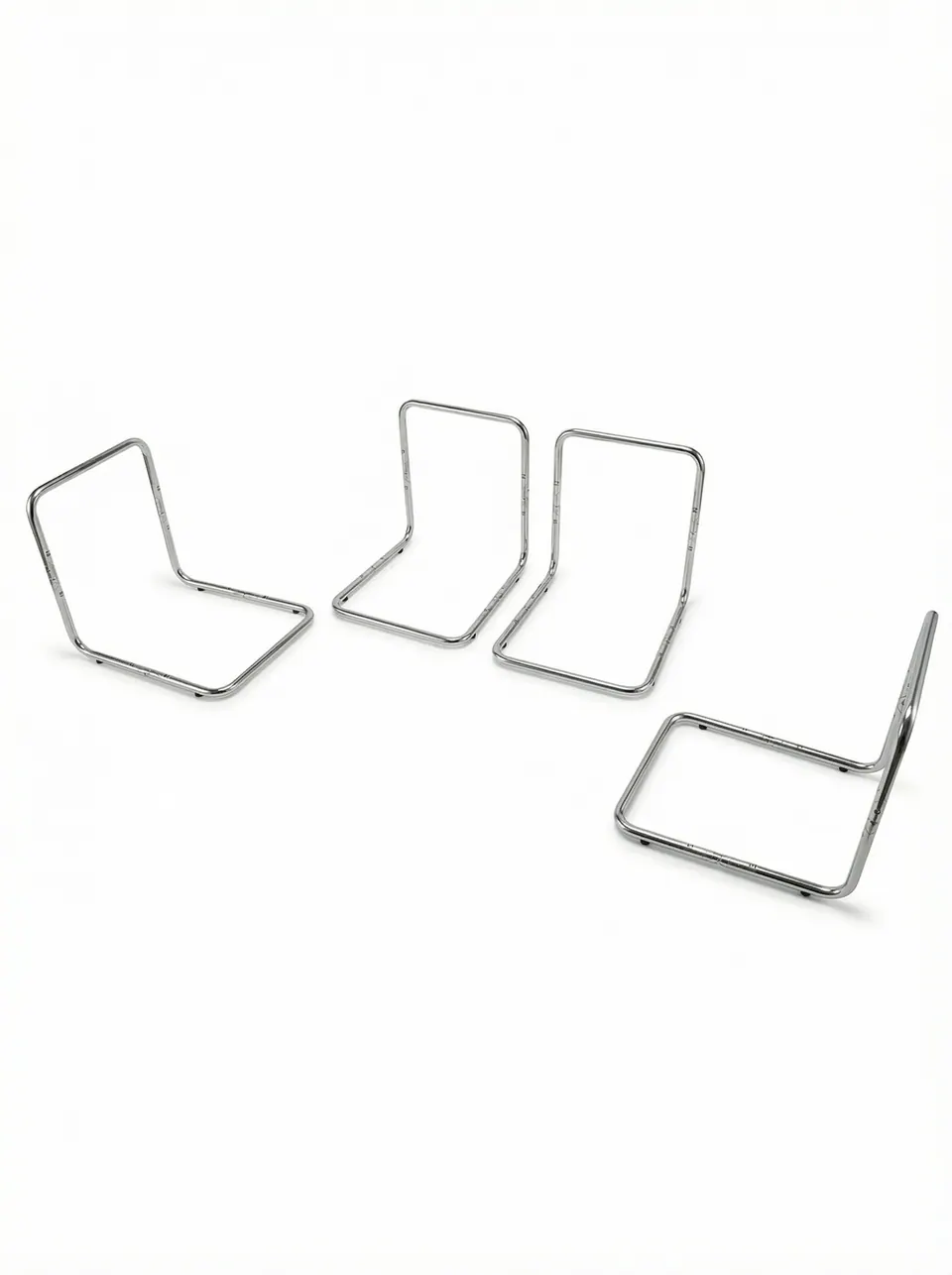 Four chrome-plated steel tube L-shaped support frames with rounded bends arranged on a plain white background