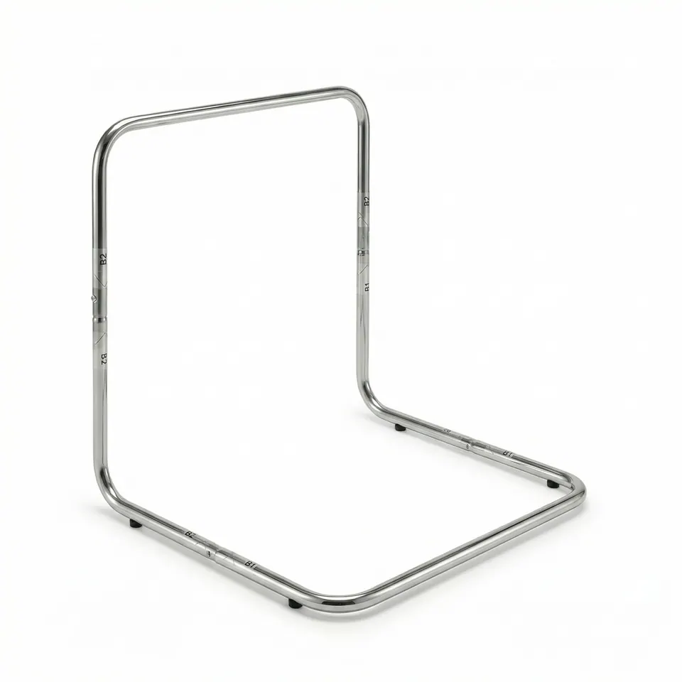 Chrome-plated tubular L-shaped frame in three-quarter view on white, showing printed joint marks and small black rubber feet