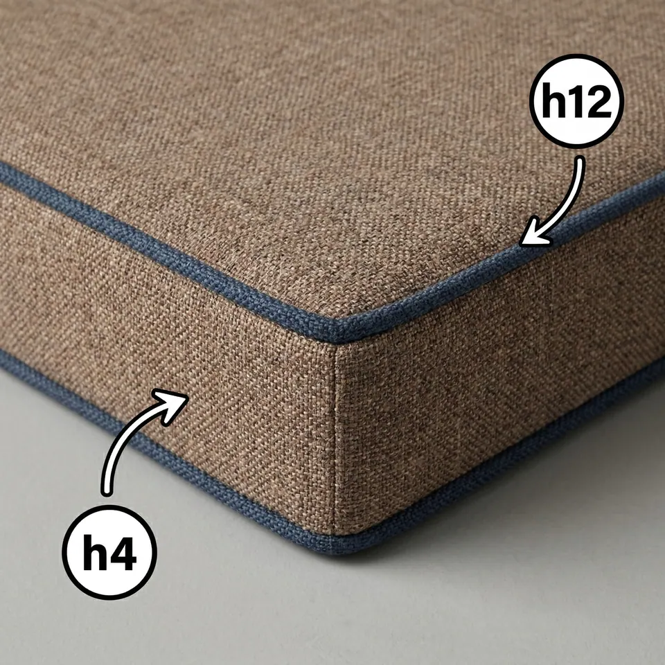 Close-up of a mocha brown woven box cushion with denim blue piping, arrows marking the piping and the side panel