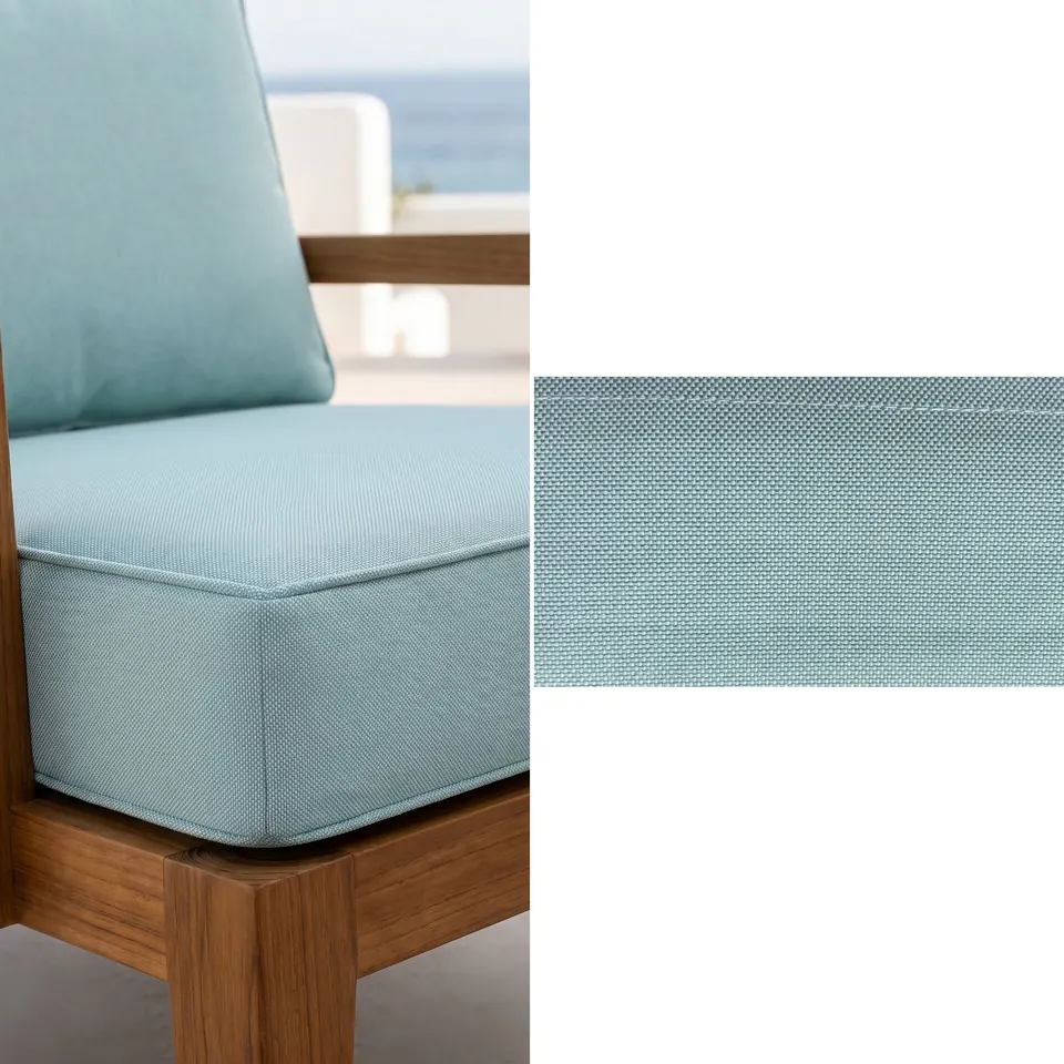 Duck-egg blue box seat cushion and back cushion with self piping on a teak lounge chair overlooking the sea, fabric strip