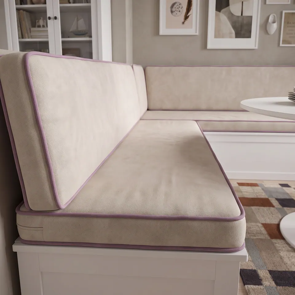 Side profile of oat velvet box seat and back cushion with lavender piping and a zipper tab on a white banquette