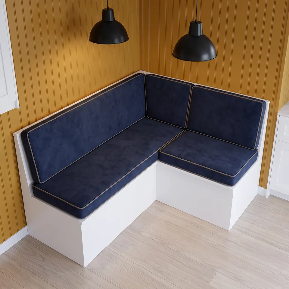 White L-shaped corner banquette with navy velvet seat and back cushions, sand piping, ochre beadboard and black pendants