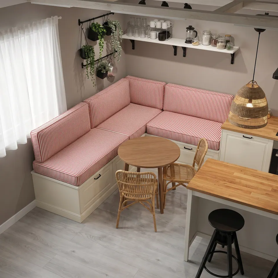 Red and white pinstripe L-shaped banquette cushions on cream drawer benches around a round table with rattan chairs