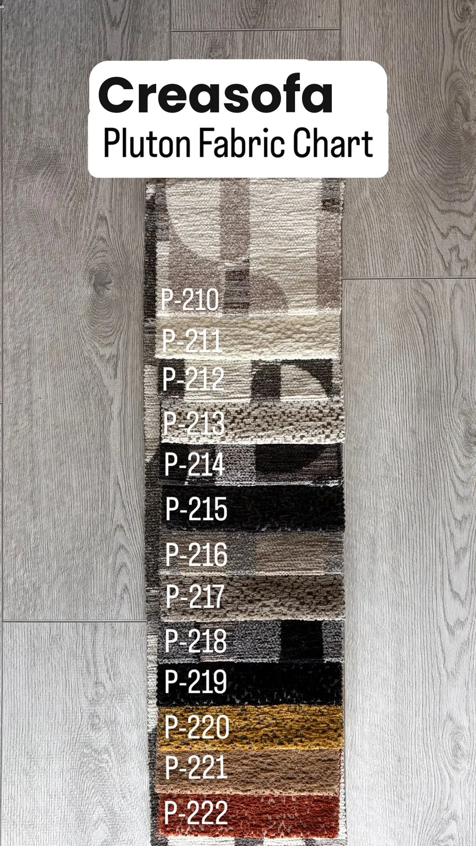 Strip of textured chenille and boucle upholstery swatches P-210 to P-222 in ivory, greige, charcoal, black, ochre and rust