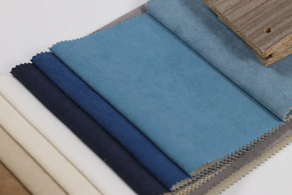 Mid blue linen-look fabric swatch between steel blue and cobalt, cream strips below
