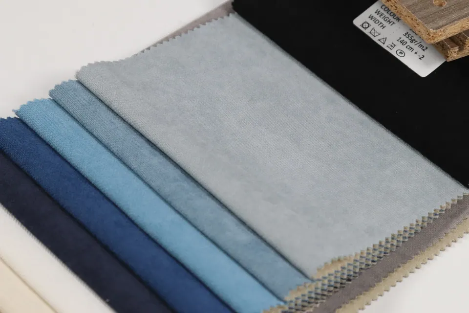 Pale silver gray linen-look swatch with a label showing 355 g/m² weight and 55 in (140 cm) width