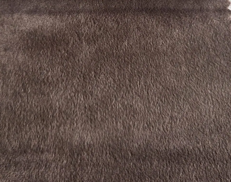 Chocolate brown velvet swatch with lighter cocoa pile tips, a pinked corner and a darker fold along the top